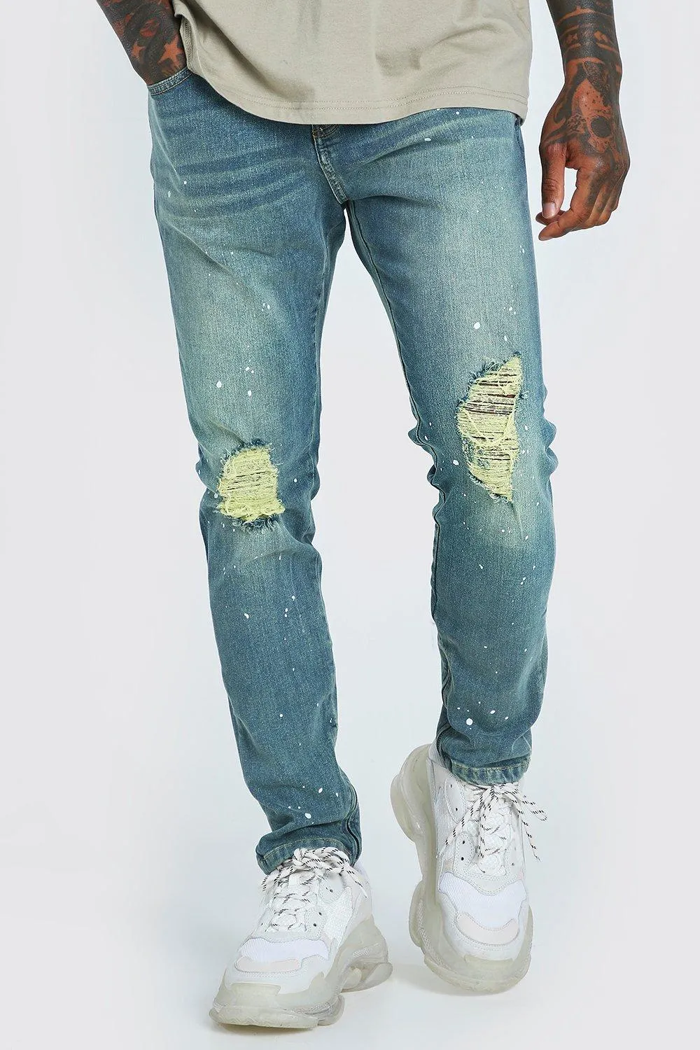 Skinny Ripped Knee Paint Splat Zip Jeans | boohooMAN UK